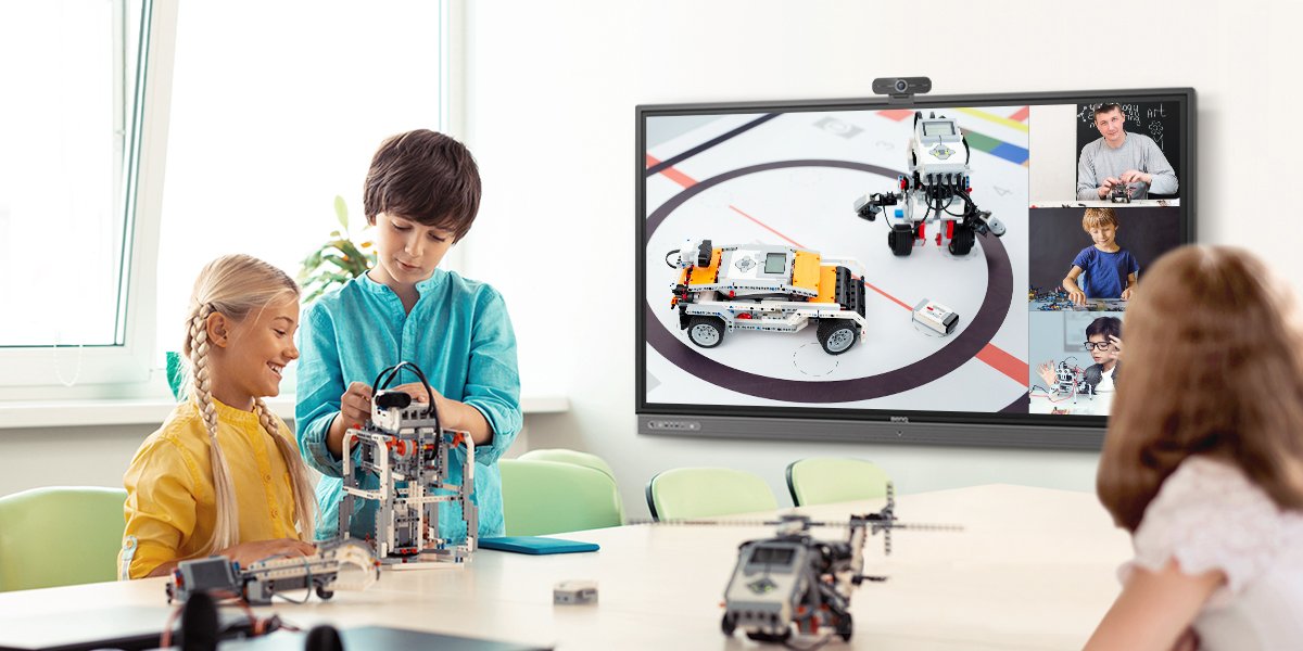 group of students completing a robot building activity in stem class with remote teaching via BenQ interactive display