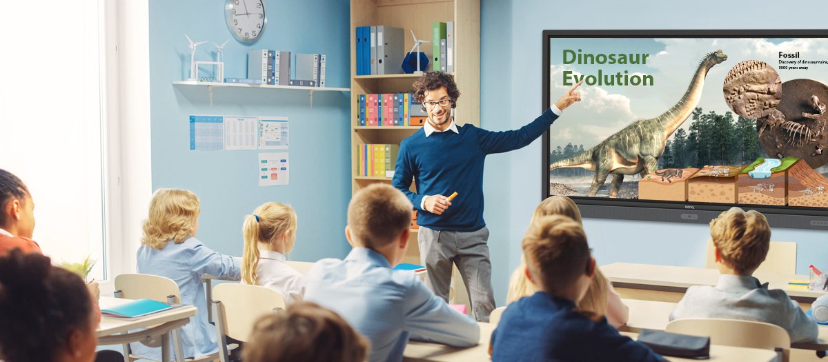 Teacher delivering class on interactive display to attentive students