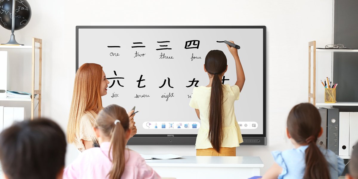 young student writing mandarin chinese caligraphy in EZWrite digital whiteboarding app on BenQ interactive display