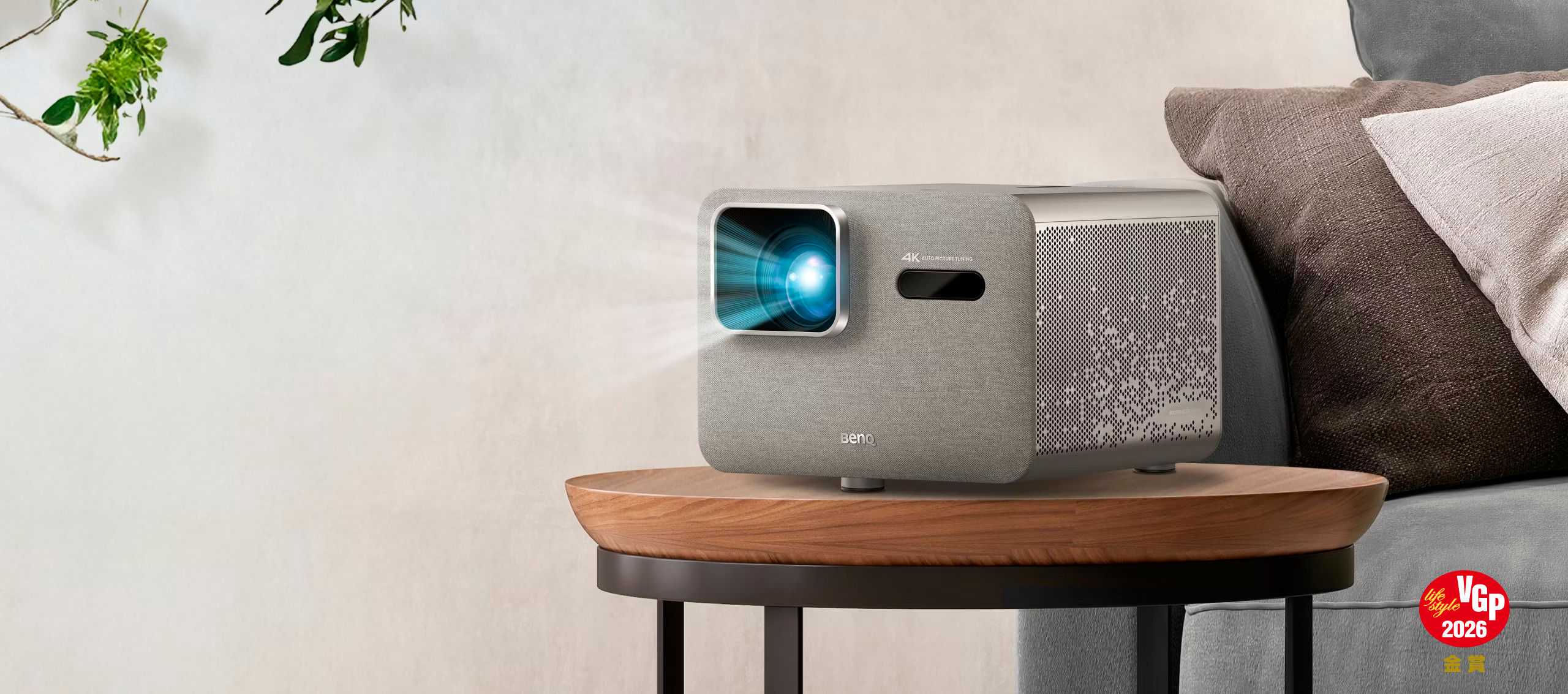 BenQ TK705i 4K HDR home entertainment projector on table in living room