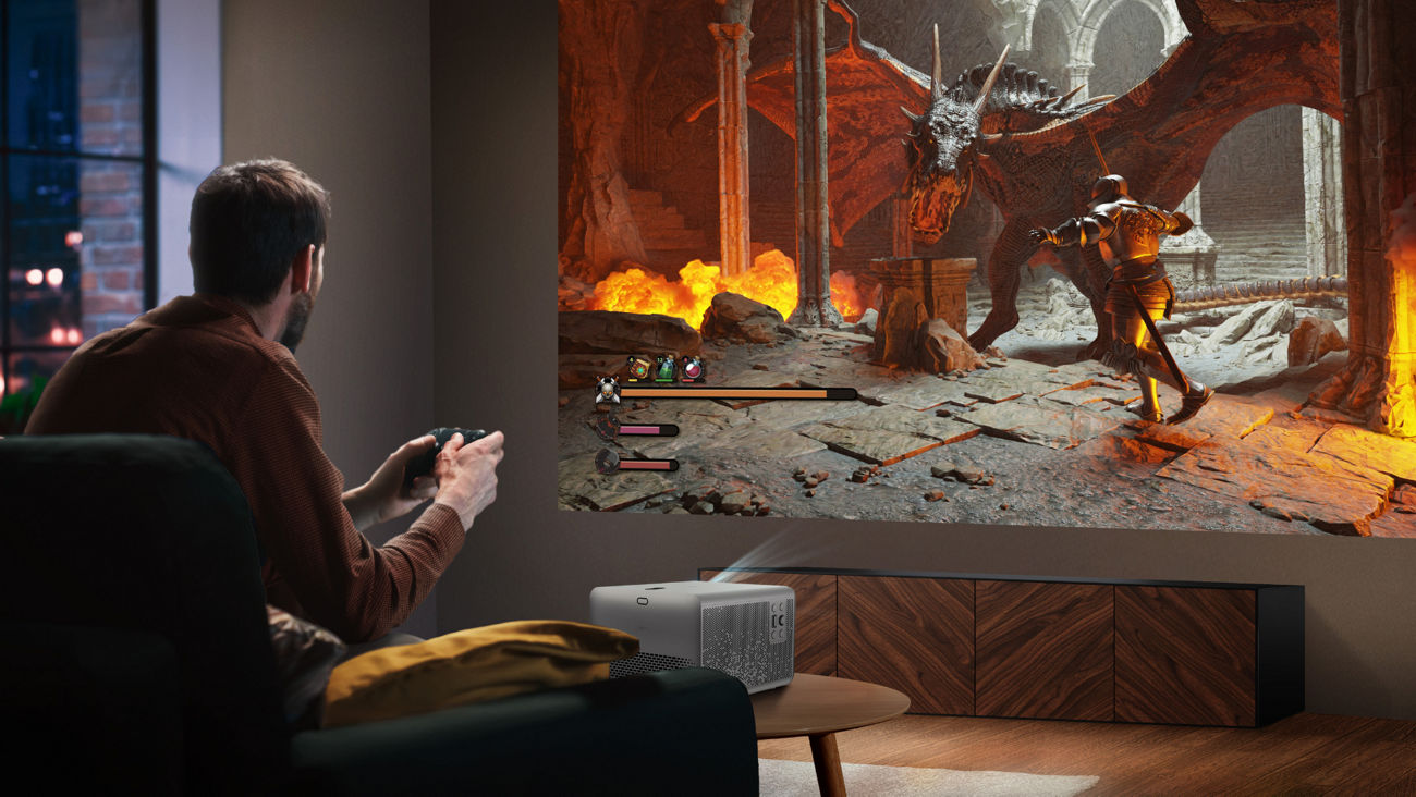 Group playing party game on BenQ TK705STi home entertainment projector with massive 150-inch screen in living room