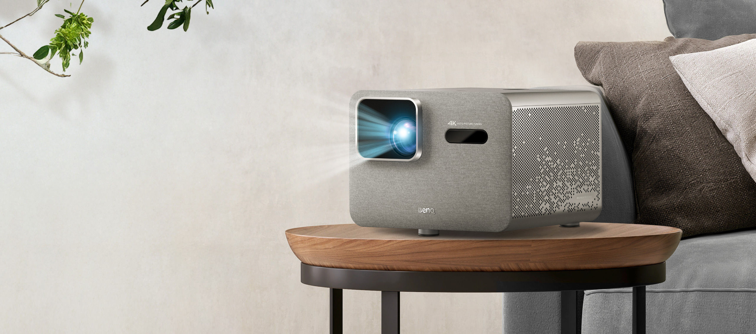 BenQ TK705STi 4K HDR short throw home entertainment projector on table in small living space