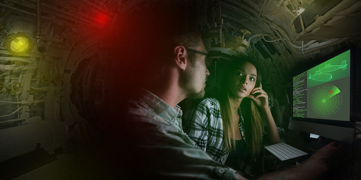 A woman and a man in a submarine with a radar beside them