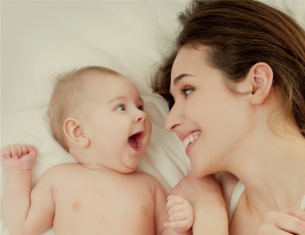 This is a scene of a mother looking at her little baby with maternal love projected by BenQ DLP projector with lamp that has been used for more than two thousand hours.