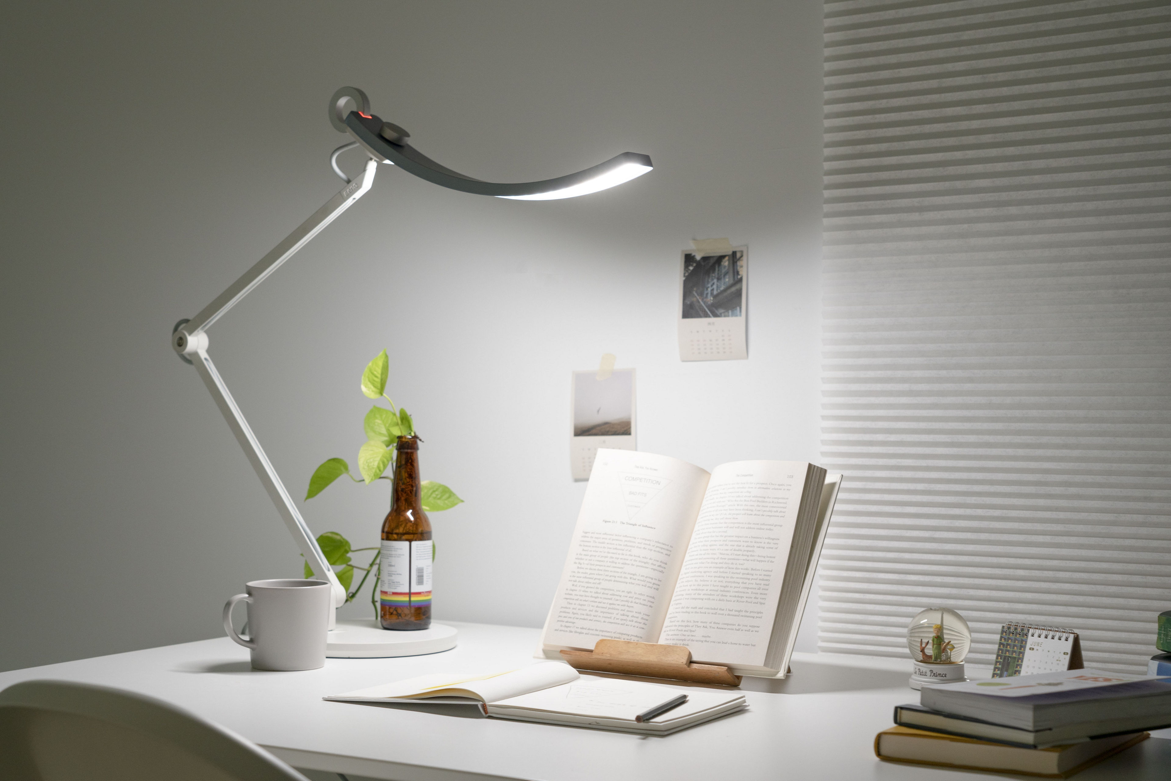 office worker staring at computer screen with BenQ e-Reading Desk Lamp