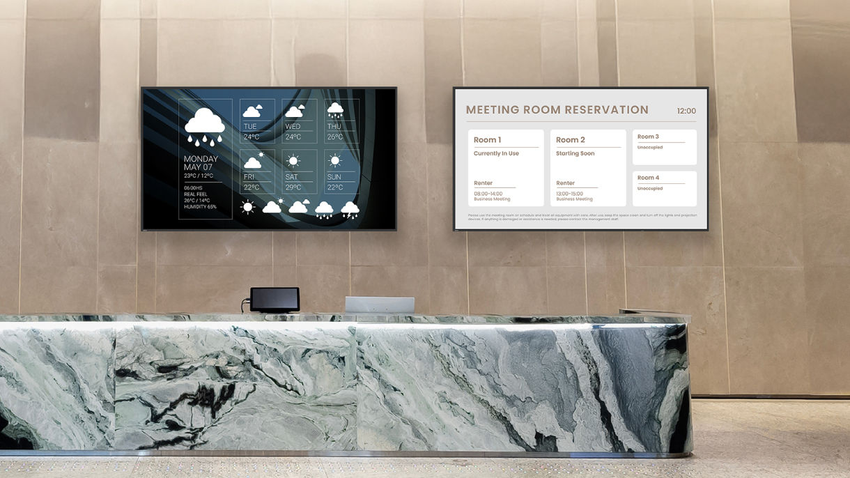 Two BenQ signage displays mounted in a luxury marble reception area showing weather information and a meeting room reservation directory for corporate communication.