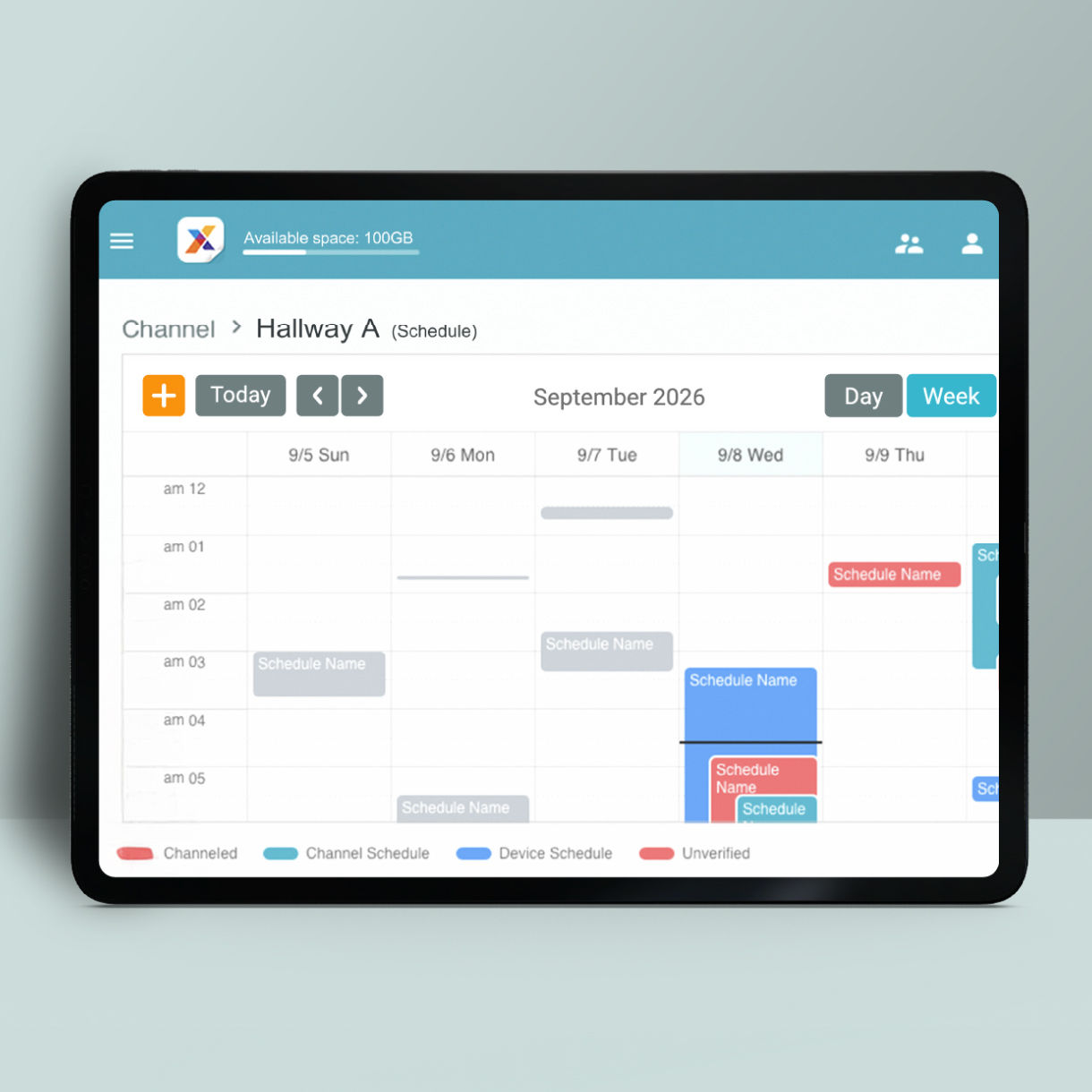 A close-up of the X-Sign content scheduling calendar on a tablet, showing organized time slots and color-coded labels for different business departments and store areas.