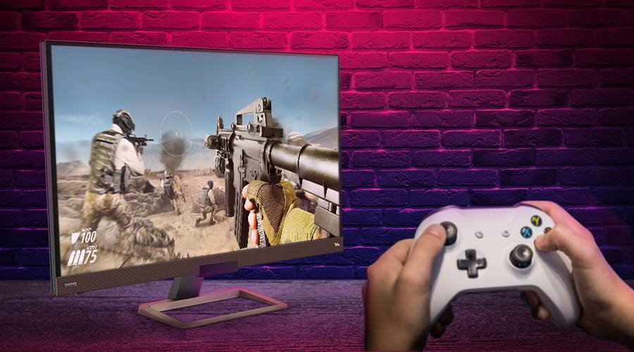 There is a gamer playing Xbox One on 4K HDR settings on your BenQ monitor.